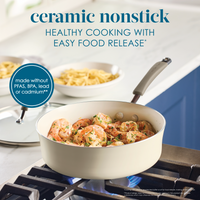 Nonstick ceramic skillet with food, pasta bowls in background.