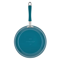 An 8-piece teal ceramic nonstick cookware set shown from above, handle visible.