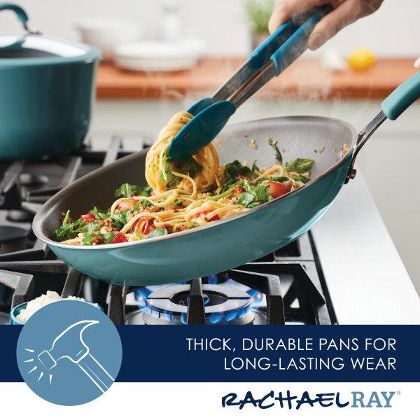 Showcasing the Cook + Create Nonstick Frying Pan on the gas stove, this durable cookware effortlessly manages spaghetti and vegetables with its thicker gauge aluminum construction.