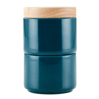 Dark teal ceramic jar with a light wooden lid, ideal for organizing spices. This stylish piece from the Stacking Spice Box Set is designed to integrate seamlessly with your other stacking containers.