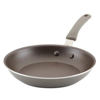 Cook + Create Nonstick Frying Pan, featuring a high-performance nonstick surface, a gray handle with two rivets, and crafted from durable aluminum.