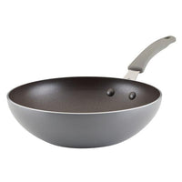 The 10.5-Inch Cook + Create Nonstick Open Stir Fry pan comes in gray aluminum and is equipped with a curved handle and a nonstick surface.