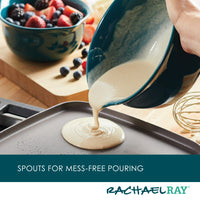 Batter being poured onto a griddle from the 2-Piece Ceramic Mixing Bowl Set, with berries and a whisk in the background.