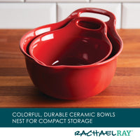 The 2-Piece Ceramic Mixing Bowl Set, elegantly designed in red ceramic, nestles perfectly together on a wooden surface. These bowls are dishwasher safe for easy cleaning and ideal for mixing or serving your favorite dishes.
