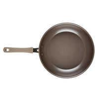 A Cook + Create Nonstick Frying Pan, featuring a high-performance design with a beige handle and crafted from thicker gauge aluminum, viewed from above.