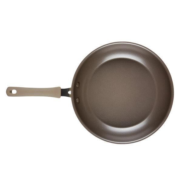 A Cook + Create Nonstick Frying Pan, featuring a high-performance design with a beige handle and crafted from thicker gauge aluminum, viewed from above.