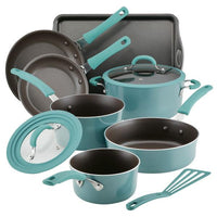The Cook + Create Nonstick Cookware Set in teal includes nonstick pots, pans, lids, a baking tray, and a spatula with scratch resistance and an oven-safe design.