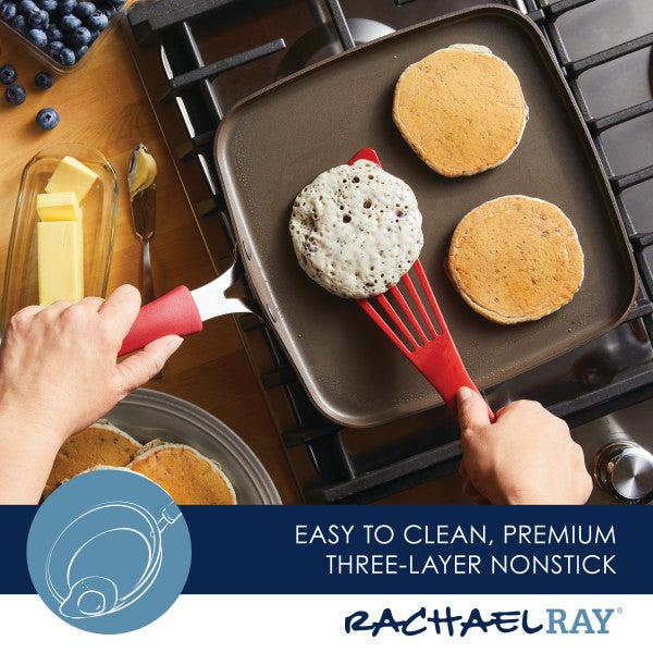 With an 11-Inch Cook + Create Nonstick Square Griddle Pan and a red spatula, a person expertly flips pancakes, showcasing impressive stovetop performance.