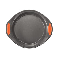 Round baking pan, part of the 5-Piece Nonstick Bakeware Set, featuring handles with orange grips, made from heavy gauge steel and safe for oven use up to 500°F.