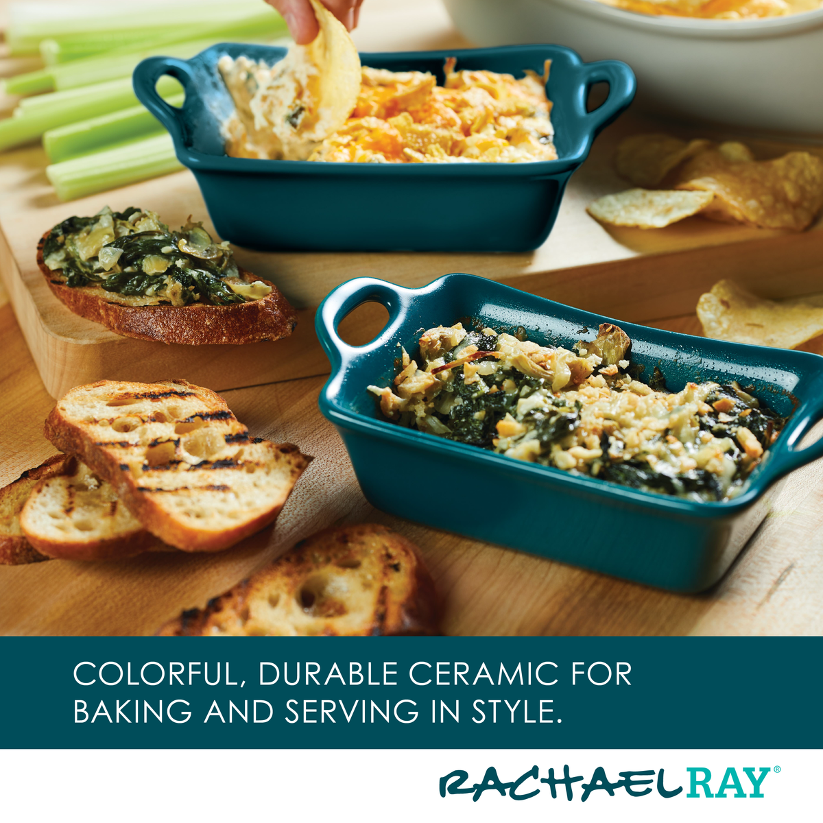 Two blue ceramic dishes with appetizer dips, toasted bread, and celery.