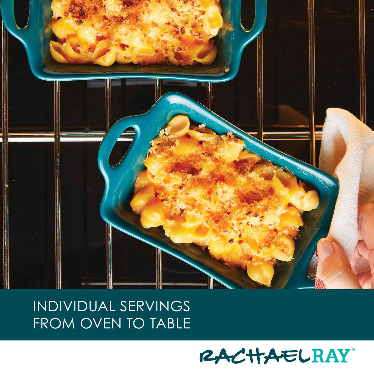 Two dishes of baked macaroni and cheese are being taken out of the oven.