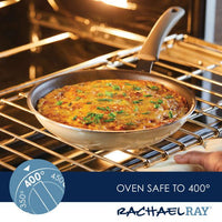 A Cook + Create Nonstick Frying Pan containing a baked dish is positioned in the oven, labeled as safe for oven use up to 400 degrees, and made from thicker gauge aluminum.