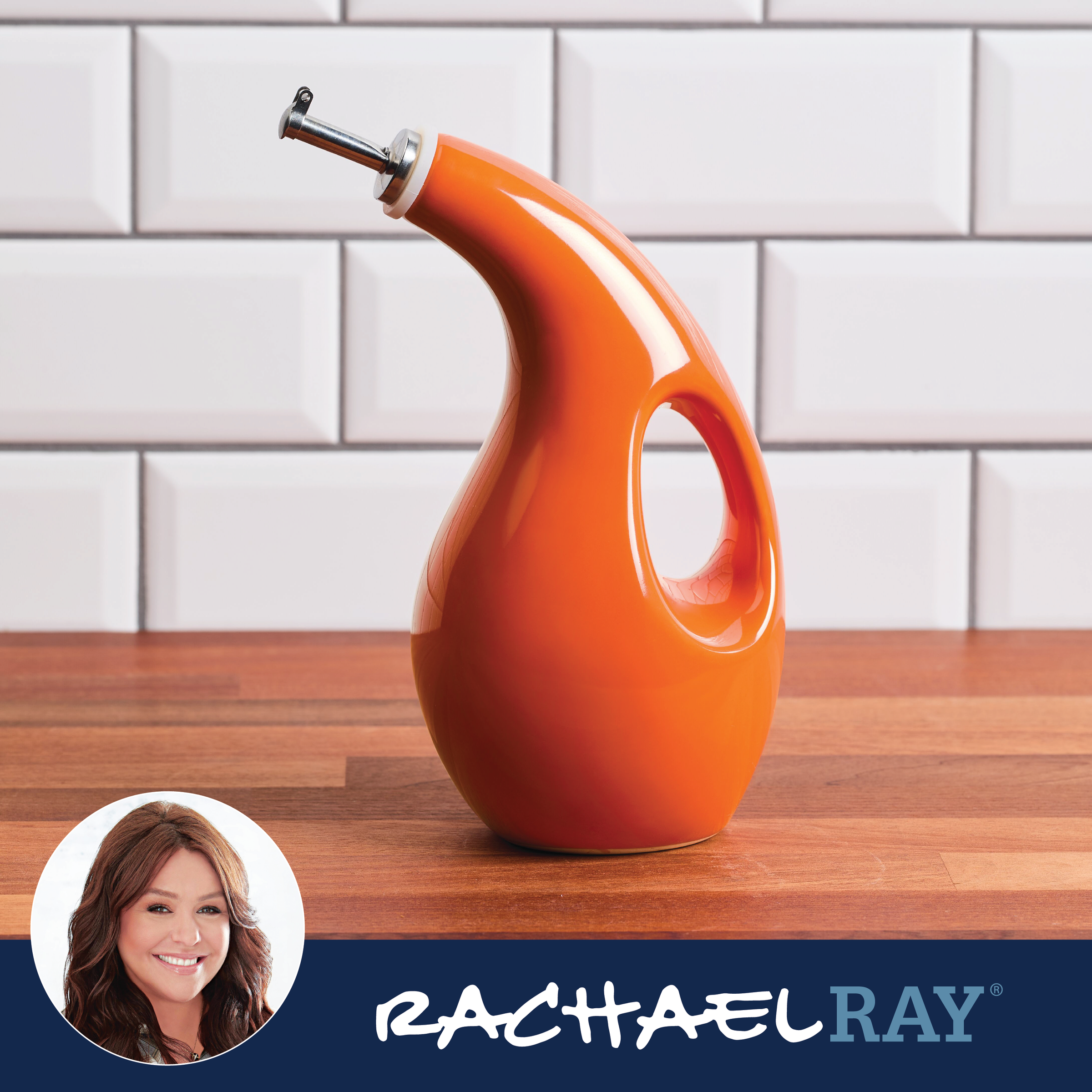 Orange dispenser bottle on counter, white tiled wall background.