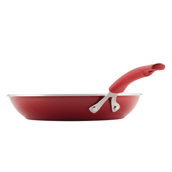 The Cook + Create Nonstick Frying Pan, designed with thicker gauge aluminum for high performance, features a sleek handle and is beautifully presented against a white background.
