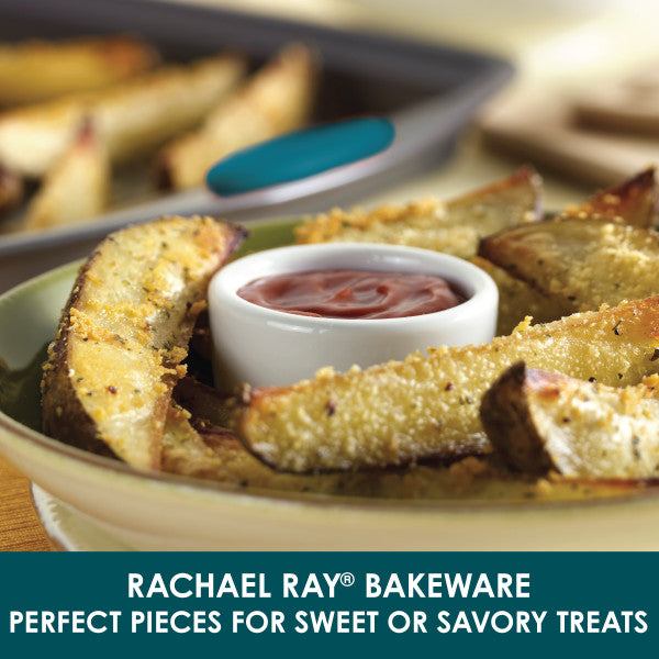 Potato wedges with dip on a plate, set on the Rachael Ray 10-Piece Nonstick Bakeware Set. The nonstick, oven-safe design makes cooking and cleanup effortless.