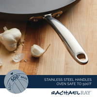 14" Hard Anodized Frying Pan handle next to garlic on a wooden surface.