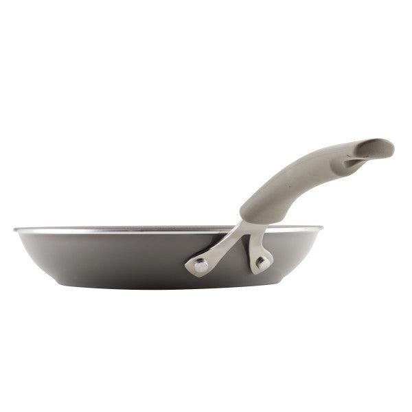 Side view of a Cook + Create Nonstick Frying Pan, crafted from thicker gauge aluminum with a curved handle for high performance.