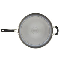 Top view of a Cook + Create Hard Anodized Nonstick Frying Pan made from hard-anodized aluminum, showcasing a handle and a helper handle with triple-layer nonstick coating.
