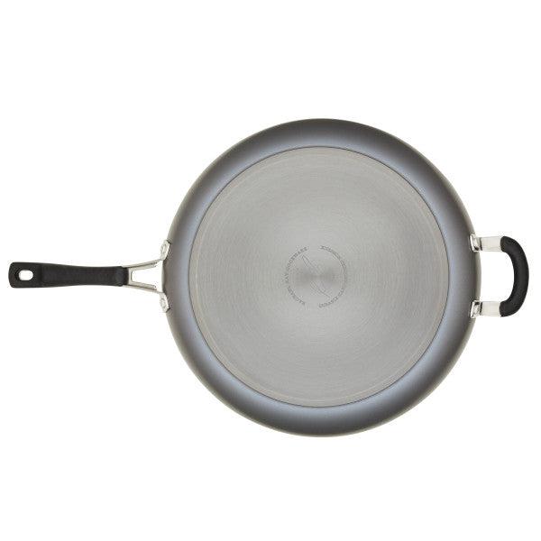 Top view of a Cook + Create Hard Anodized Nonstick Frying Pan made from hard-anodized aluminum, showcasing a handle and a helper handle with triple-layer nonstick coating.