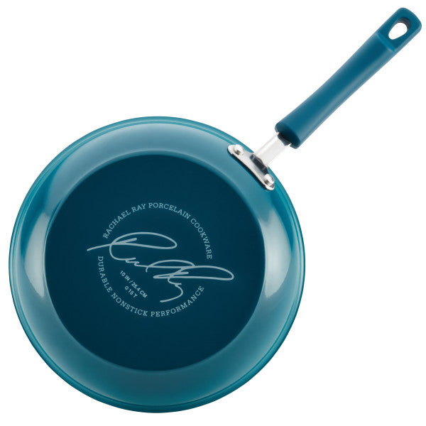 Turquoise frying pan from our Classic Brights Nonstick Cookware Sets, featuring a signature on the bottom and an oven-safe design for versatile cooking.