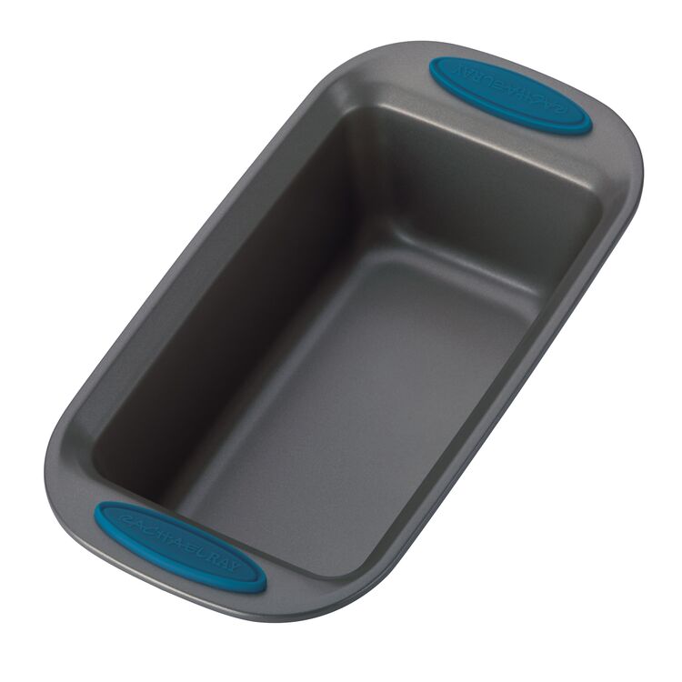 Rectangular loaf pan from the 5-Piece Nonstick Bakeware Set, made with heavy gauge steel and equipped with blue silicone handles. It is oven safe up to 500°F, making it an essential addition to any bakeware collection.