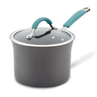 Gray saucepan with a teal handle and a clear glass lid.