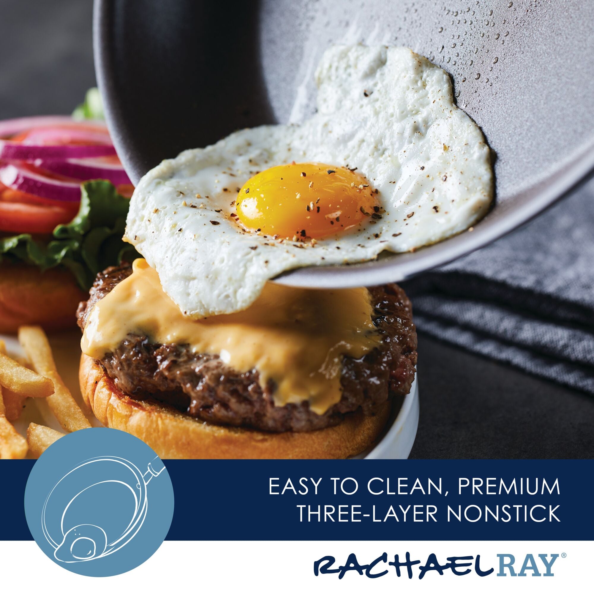 Burger topped with cheese and a fried egg, all perfectly cooked using our 6-Piece Cook + Create Nonstick Cookware Set, served with fries and salad.