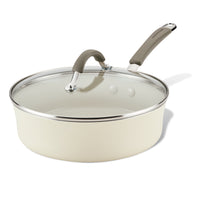 Cream-colored Ceramic Nonstick Saute Pan with glass lid and gray handle.