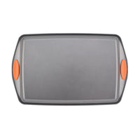 Rectangular baking tray with orange silicone handles on each side.
