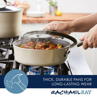A person is expertly sautéing vegetables in a 3-Quart Cook + Create Nonstick Sauté Pan with Lid on the stove, with steam rising gracefully.