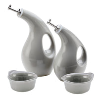 Curved oil dispensers and small bowls with a modern design.