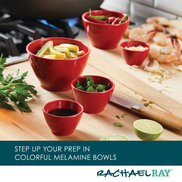 A 10-Piece Mix, Measure, and Utensil Set sits on the kitchen counter, nestled among assorted ingredients, showcasing true kitchen essentials.
