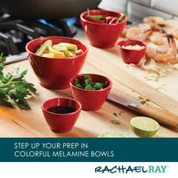 A 10-Piece Mix, Measure, and Utensil Set sits on the kitchen counter, nestled among assorted ingredients, showcasing true kitchen essentials.