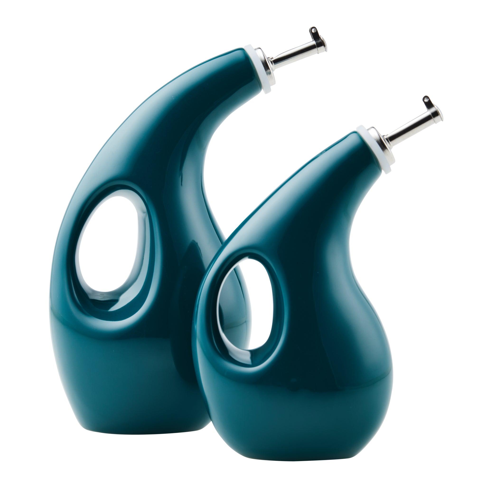 The 2-Piece EVOO and Vinegar Bottle Set, inspired by Rachael Ray's signature style, includes two teal ceramic bottles with sleek stainless steel spouts. These bottles are perfect for elegantly and functionally storing EVOO or other oils.