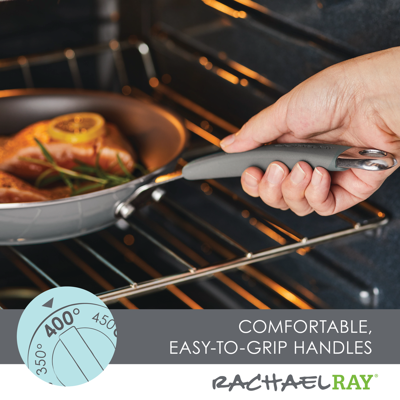 A hand grips the 10-Piece Cucina Nonstick Cookware Set's rubberized stainless steel handle, guiding the versatile cookware with salmon and lemon slices into the oven.
