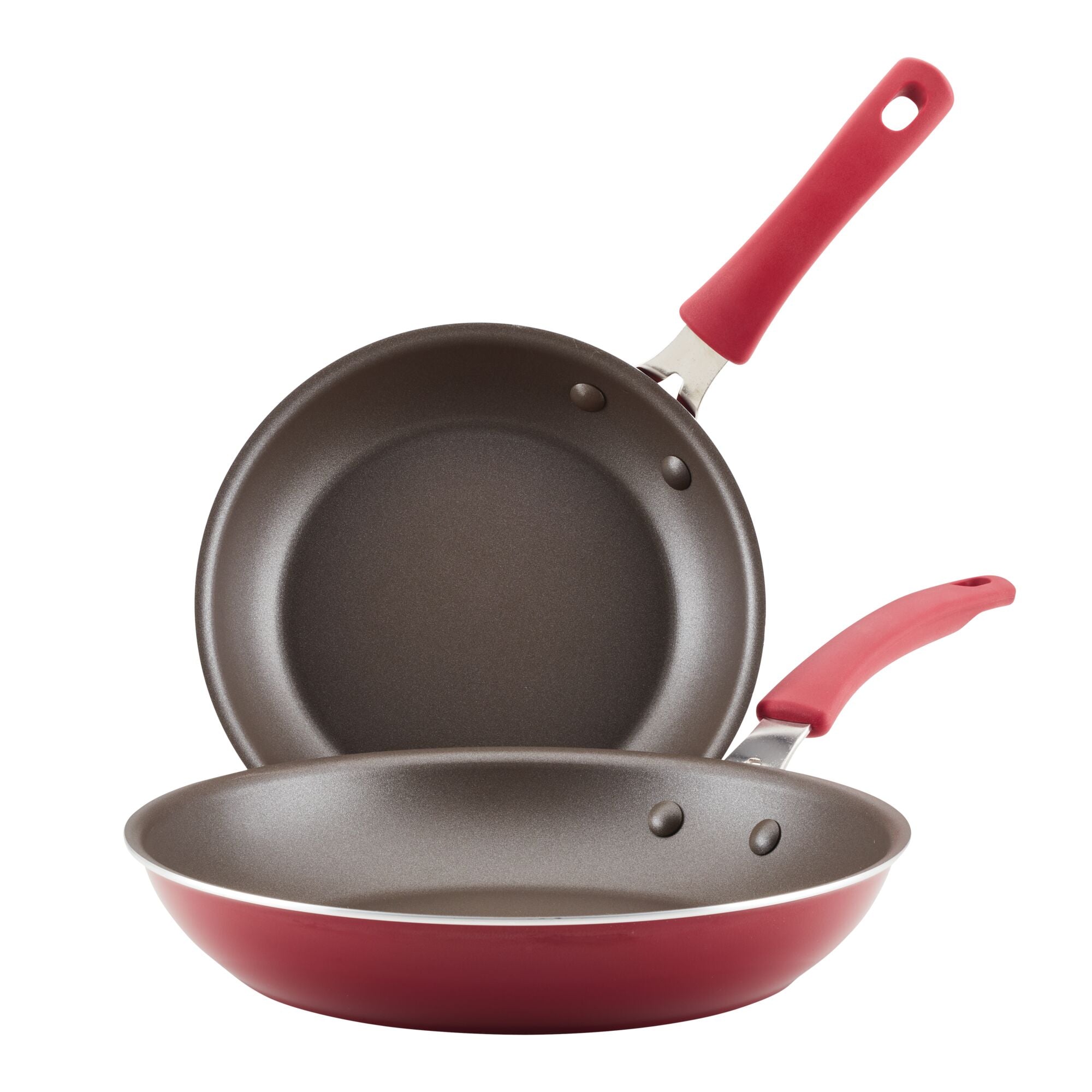 A set of two frying pans from the Cook + Create Nonstick Frying Pan Set, featuring nonstick interiors, durable aluminum construction, and matching red handles.
