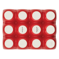 Contemporary red silicone 12-cup ceramic egg tray, ideal for versatile hors d'oeuvres presentations.