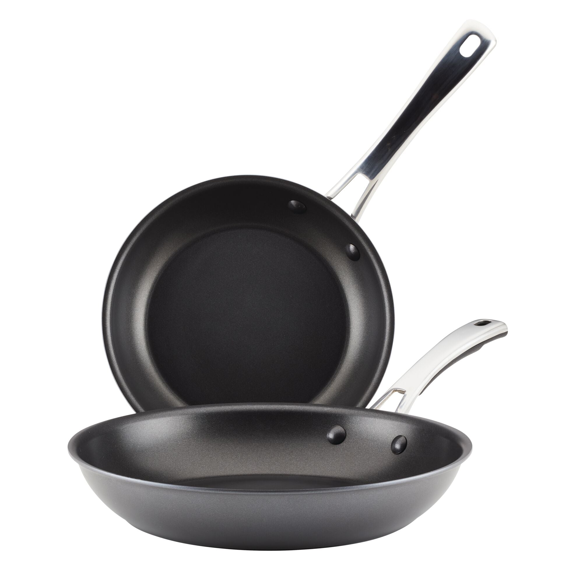 The 2-Piece Cook + Create Hard Anodized Nonstick Frying Pan Set includes two black frying pans crafted from hard-anodized aluminum, featuring metal handles and designed to nest together for convenience.