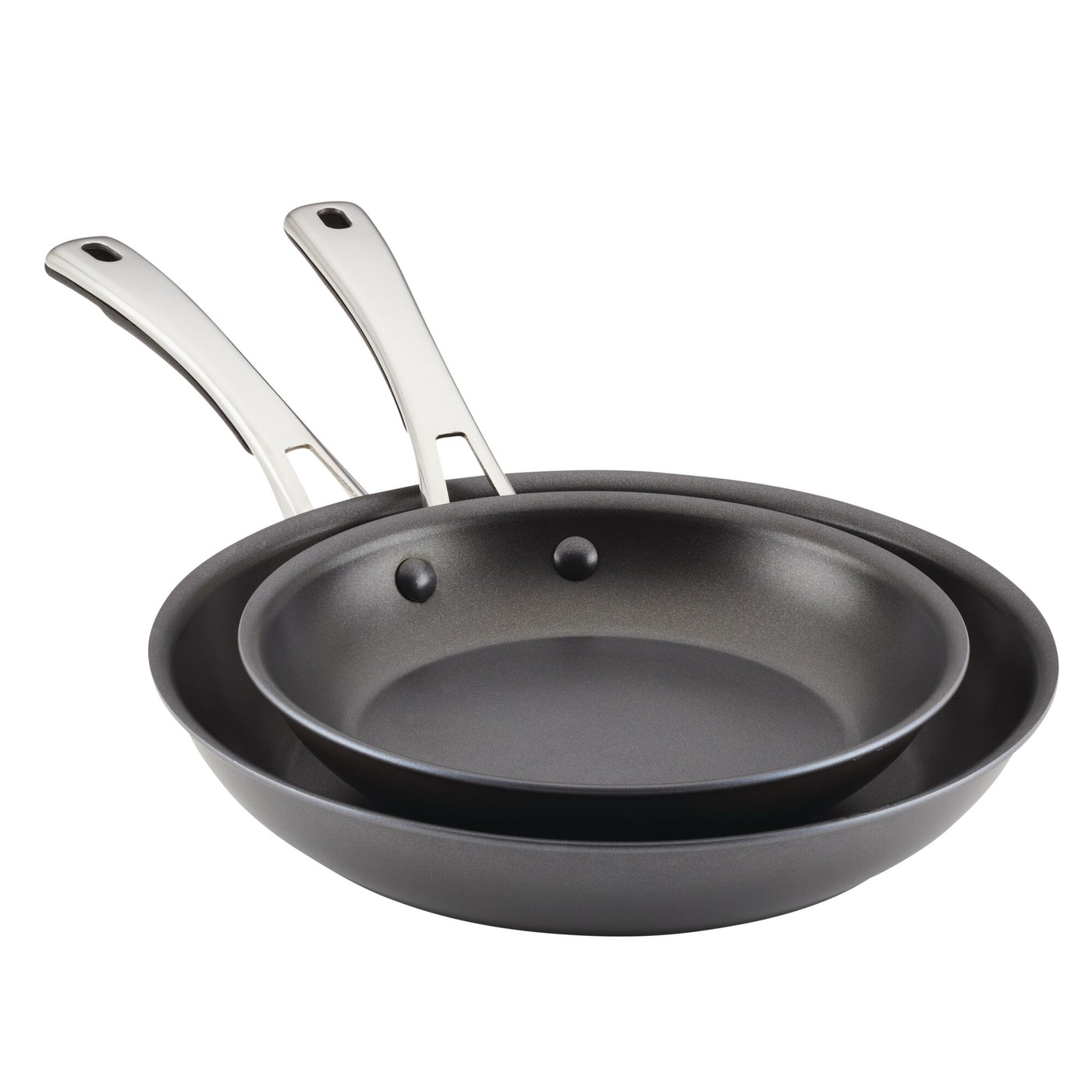 The two frying pans from the 2-Piece Cook + Create Hard Anodized Nonstick Frying Pan Set are stacked neatly, showcasing their gleaming stainless steel handles.