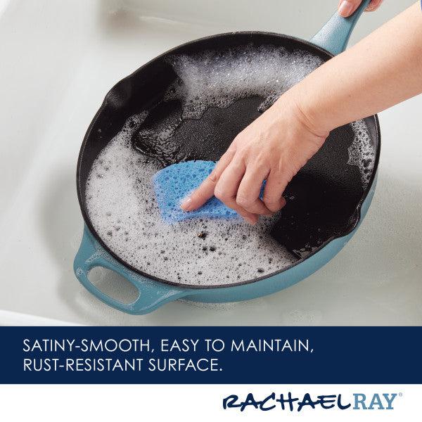 Cleaning the 12-Inch NITRO Cast Iron Skillet by hand with a soapy sponge in the sink.