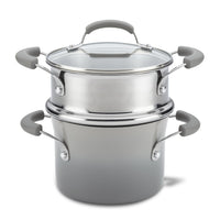 The 3-Quart Classic Brights Nonstick Covered Steamer Set features a stainless steel saucepot with a glass lid and grey handles, ideal for steaming vegetables or creating the perfect pasta dish.