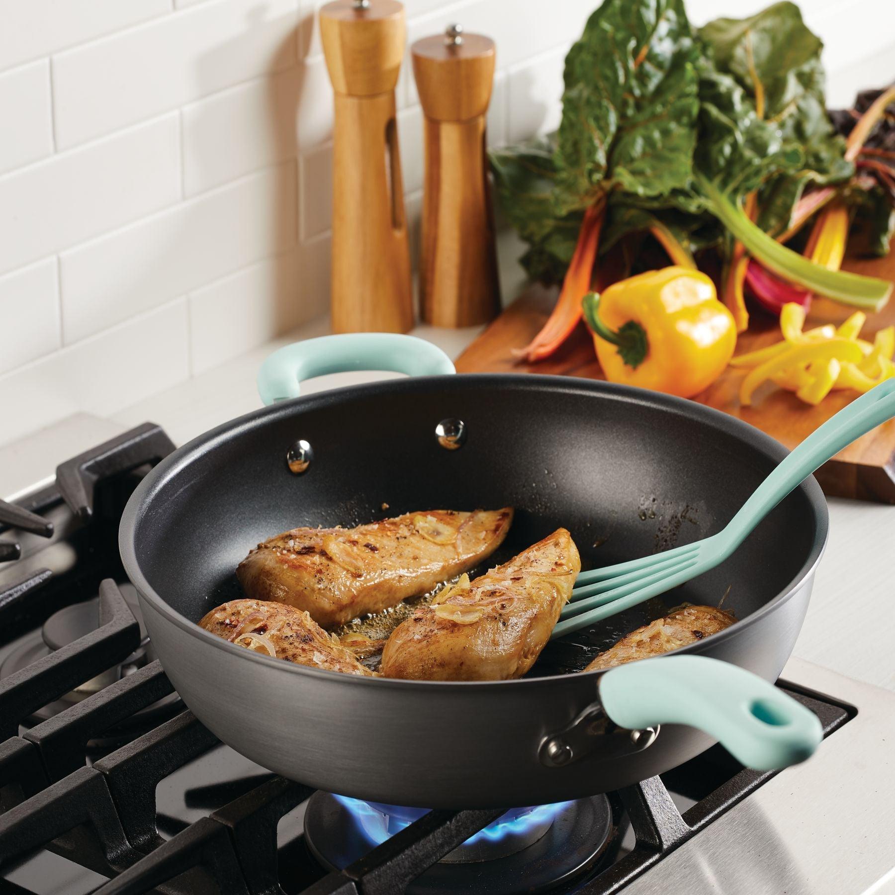 Three pieces of chicken cook in a 12.5-inch nonstick induction frying pan.