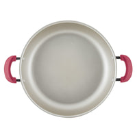 Top view of empty 8-piece nonstick induction cookware with red handles.