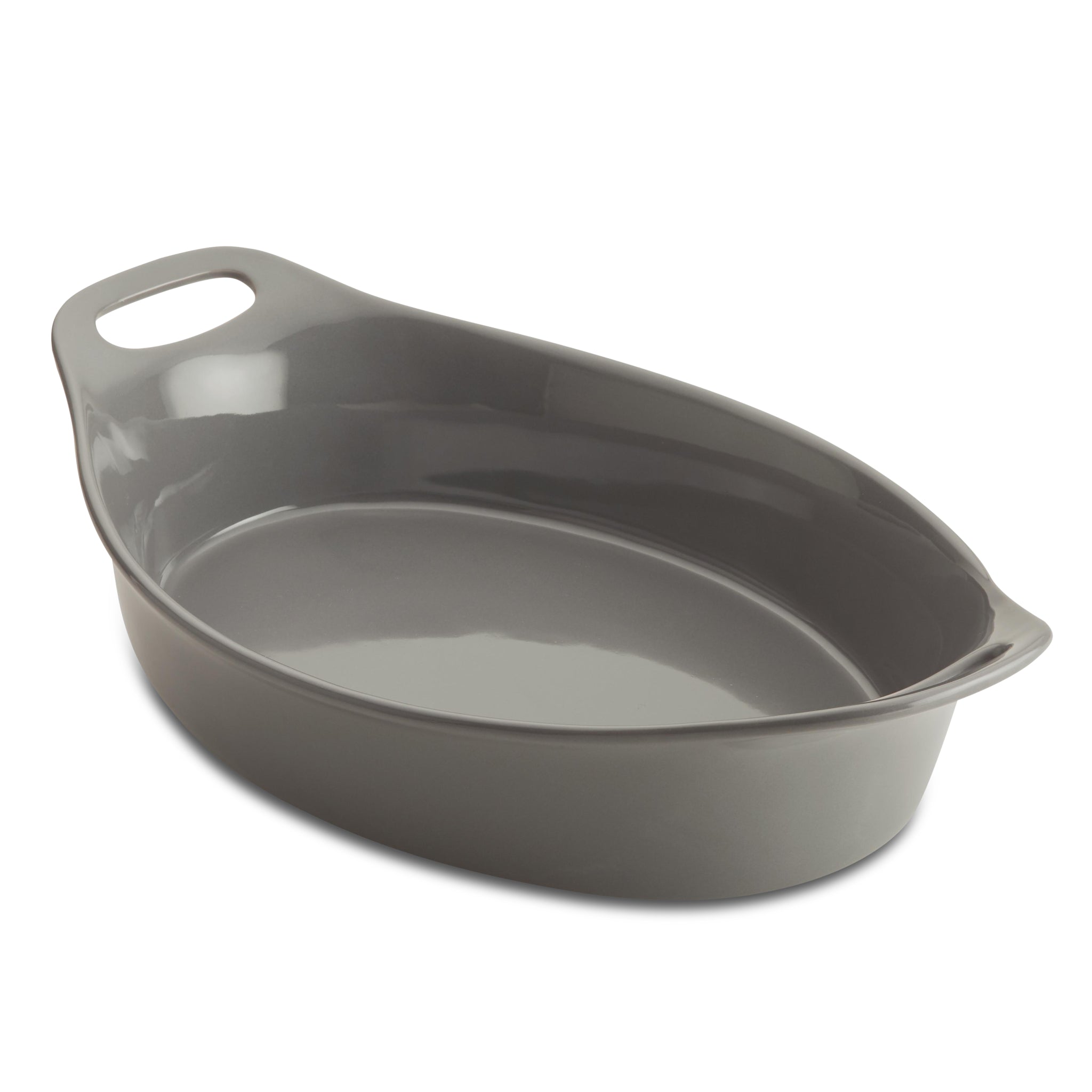 The Ceramic Oval Bakers, featuring a convenient handle, sits empty against a pristine white background. Designed for versatility, it transitions effortlessly from freezer to oven, making your culinary creations both stylish and effortless.