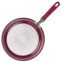 Red skillet from the 13-Piece Nonstick Induction Cookware Set with red handle.