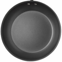 The 12-Piece Cucina Hard Anodized Nonstick Cookware Set, when viewed from above, features a sleek frying pan crafted from durable aluminum.