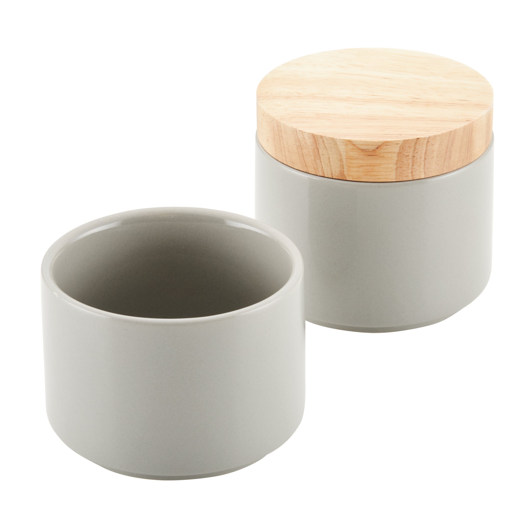 Two grey ceramic jars from the Stacking Spice Box Set, ideal for stacking storage, with one jar featuring a wooden lid.